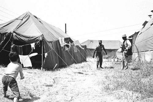 Child facing uniformed man