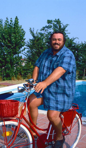 Pavarotti sitting on bicycle