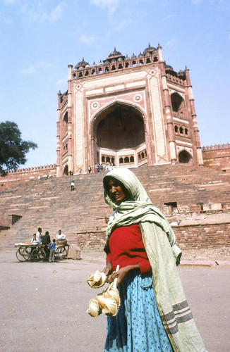 Woman outside high triumphal portal