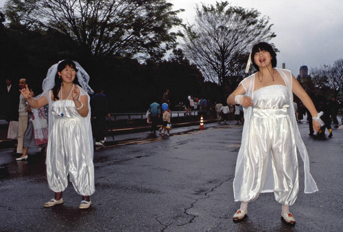 Teenagers in white dresses