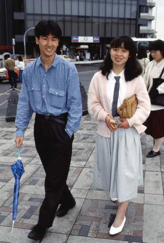 Teenagers with umbrellas