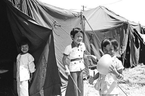 Children outside tent