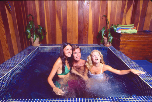 Models in indoor jacuzzi