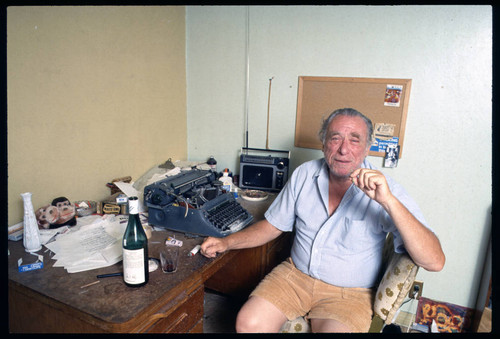 Charles Bukowski at his typewriter