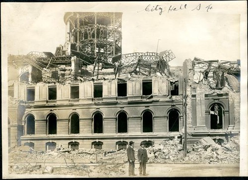 Men surveying destruction of City Hall, San Francisco, Calif