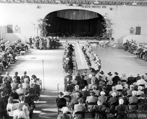 People gathered in an assembly hall at Grange convention