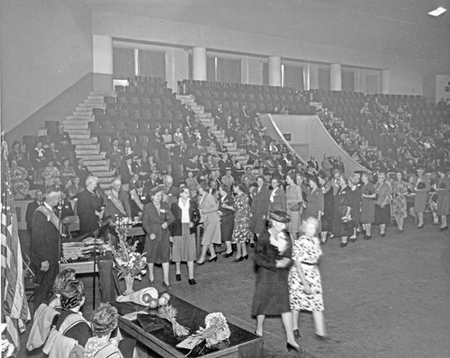 People gathered in an assembly hall at Grange convention