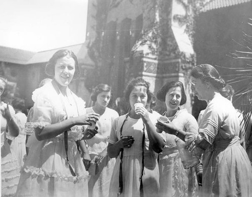 Women enjoying refreshments in the quad