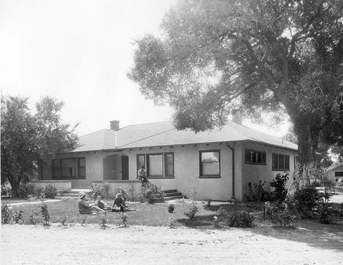 People in front of house