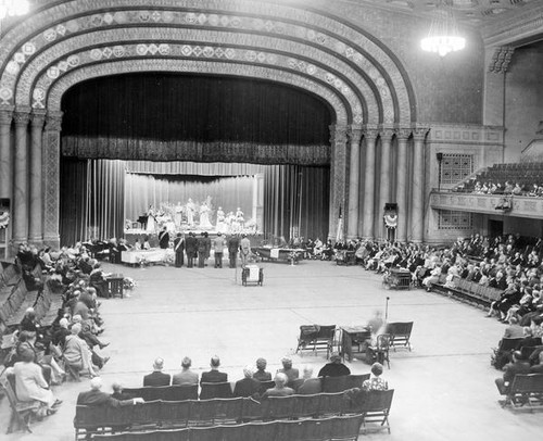 People gathered in an assembly hall at Grange convention