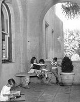 Children reading inside San Jose State's portico