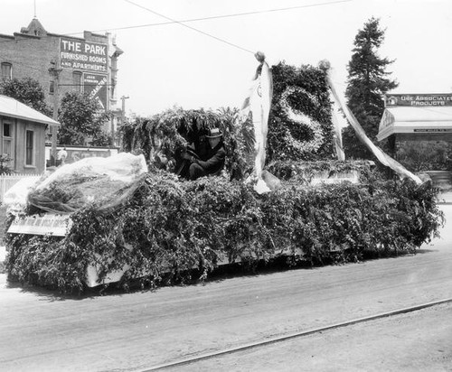 Foliage covered parade float