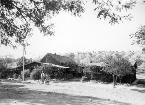 Couple in front of house