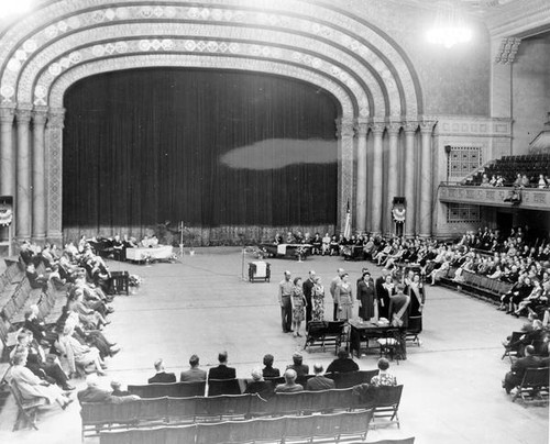 People gathered in an assembly hall at Grange convention