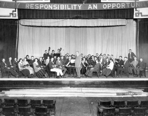 Conductor and orchestra on stage