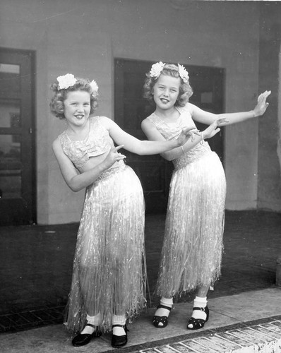 Two girls hula dancing