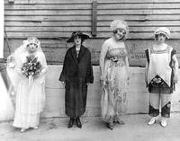 Four women posing in costumes