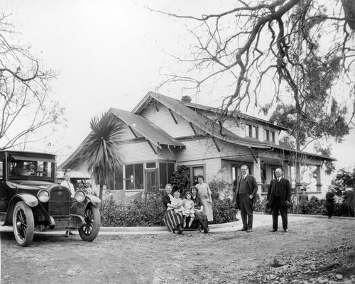 Family in front of house