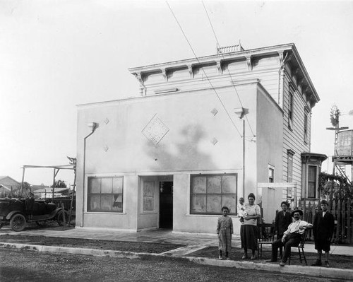 Family in front of house