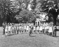 Children in a half moon circle