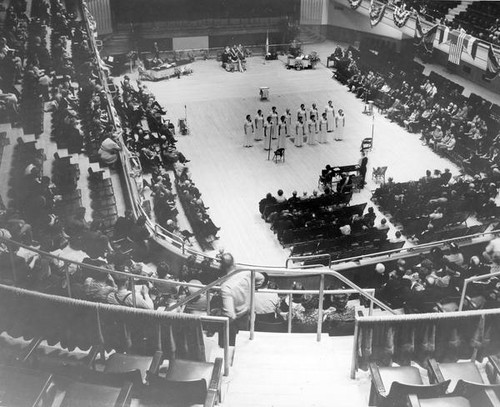 People gathered in an assembly hall at Grange convention