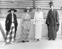 Four costumed women