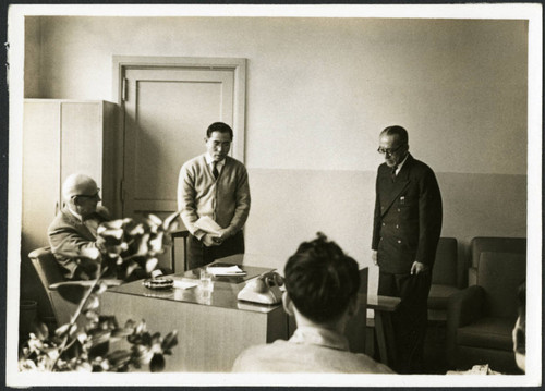 Charles Protzman sitting at a desk