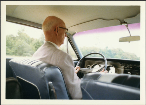 Charles Protzman sitting in a car, 1969-07-24 — Calisphere