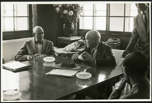 Charles Protzman sitting at a table