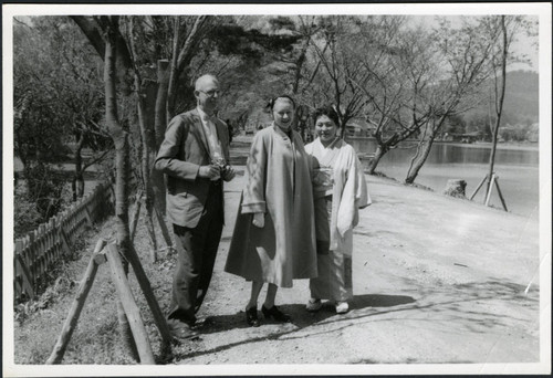 Charles Protzman and his wife standing near water