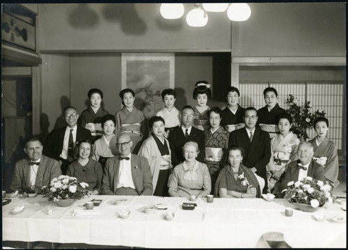 Charles Protzman and his wife with a group of people