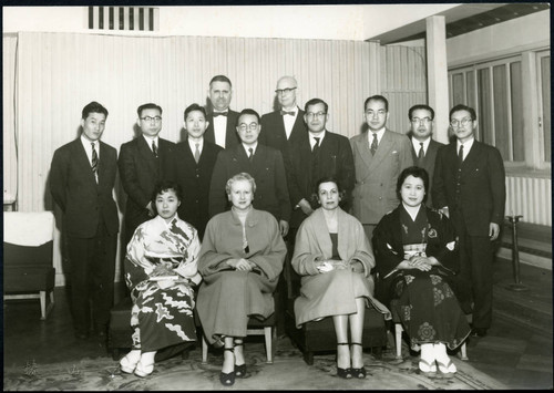 Charles Protzman and his wife with a group of people