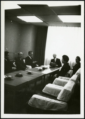 Frank and Priscilla Polkinghorn sitting with four individuals