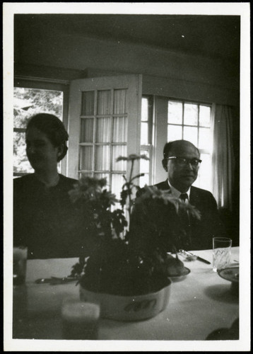 Priscilla Polkinghorn sitting next to a man at a dining table