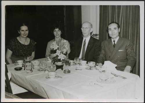 Mr. and Mrs. Polkinghorn with two individuals at a table