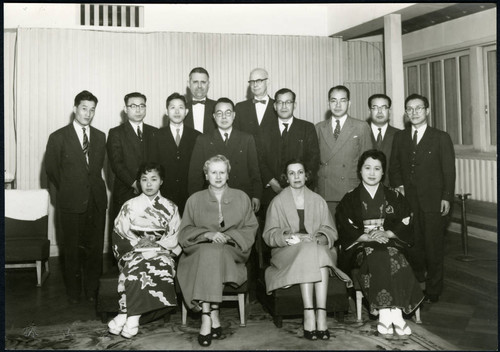 Charles Protzman and his wife with a group of people — Calisphere