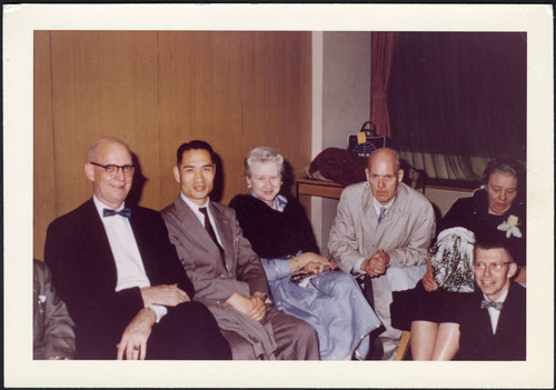 Charles Protzman and his wife seated with people, 1960-06