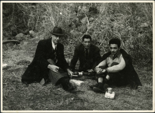 Charles Protzman and Homer Sarasohn sitting with a man — Calisphere