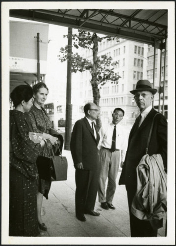 Frank and Priscilla Polkinghorn standing near three individuals