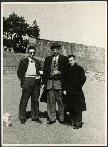 Charles Protzman and Homer Sarasohn standing with a man