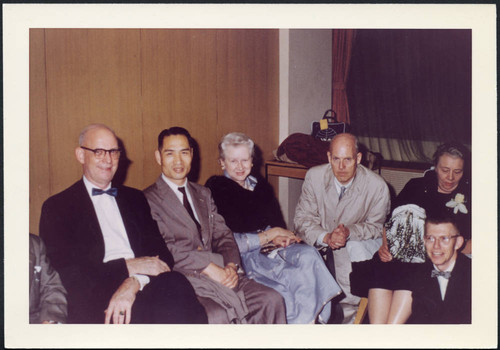 Charles Protzman and his wife seated with people, 1960-06