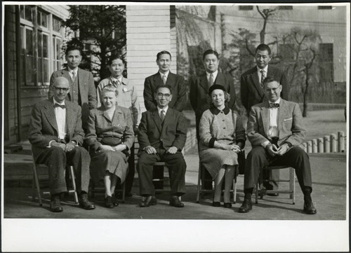 Charles Protzman and his wife with a group of people