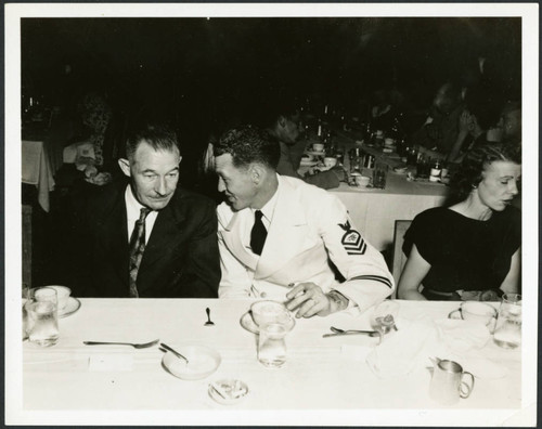 Navy radioman sitting at a table