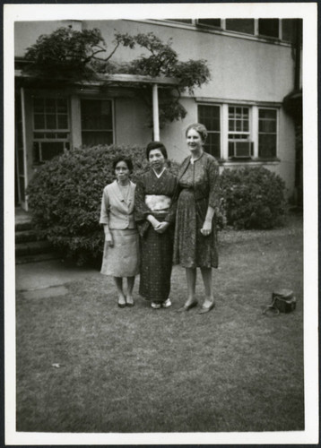 Priscilla Polkinghorn standing next to two women