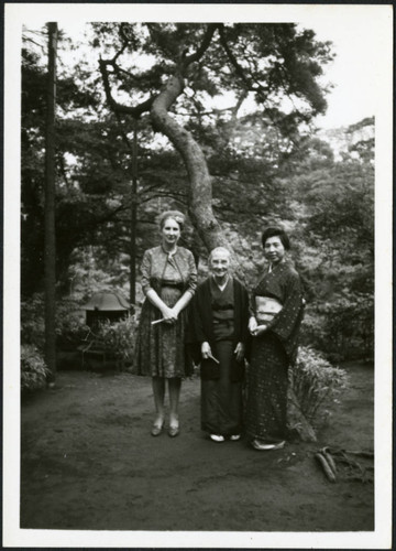 Priscilla Polkinghorn standing with two women