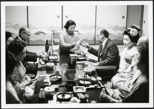 Charles Protzman sitting for a meal