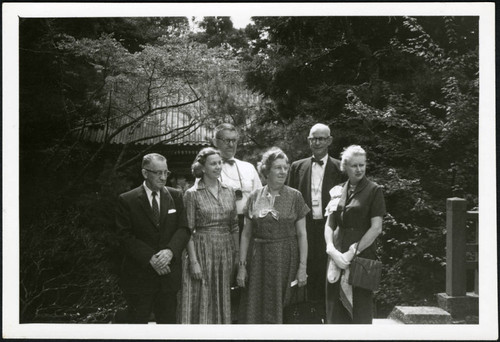 Charles Protzman and his wife with a group of people