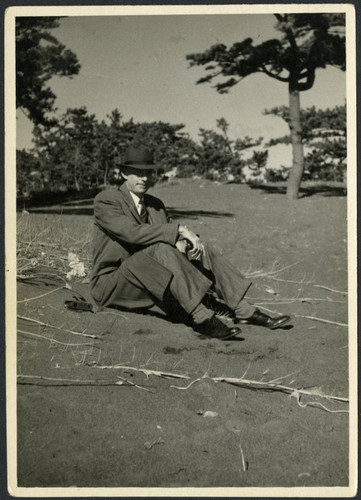 Charles Protzman sitting on the ground