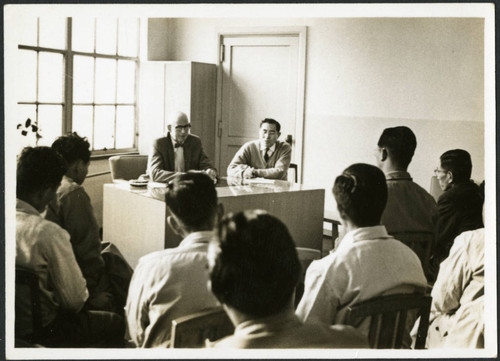 Charles Protzman sitting at a desk