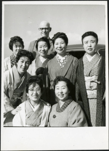 Charles Protzman with seven women, 1960-02-21